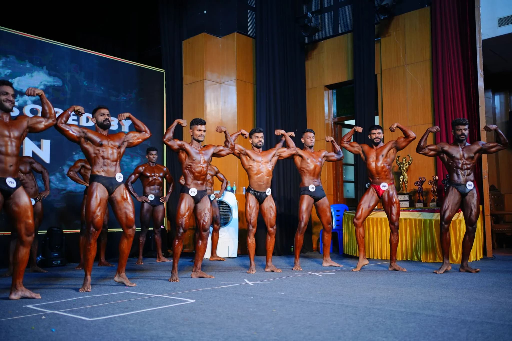 Athlete posing on championship stage
